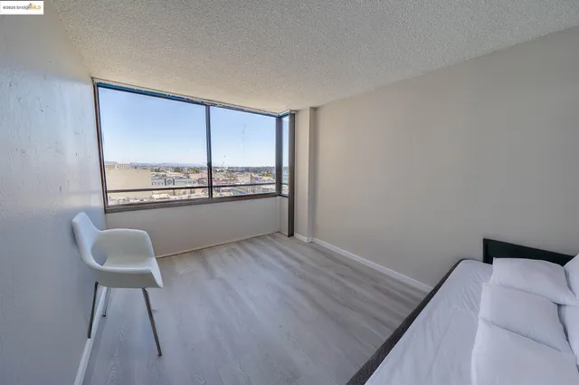a view of a room with furniture and a window