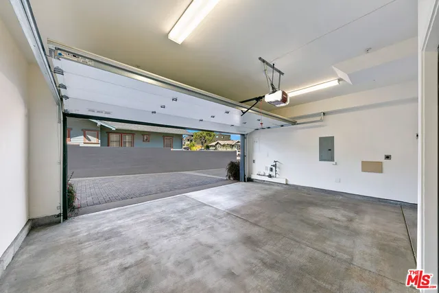 a view of a livingroom with a ceiling fan and window