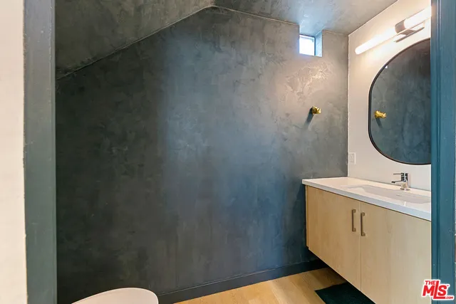 a bathroom with a sink and mirror