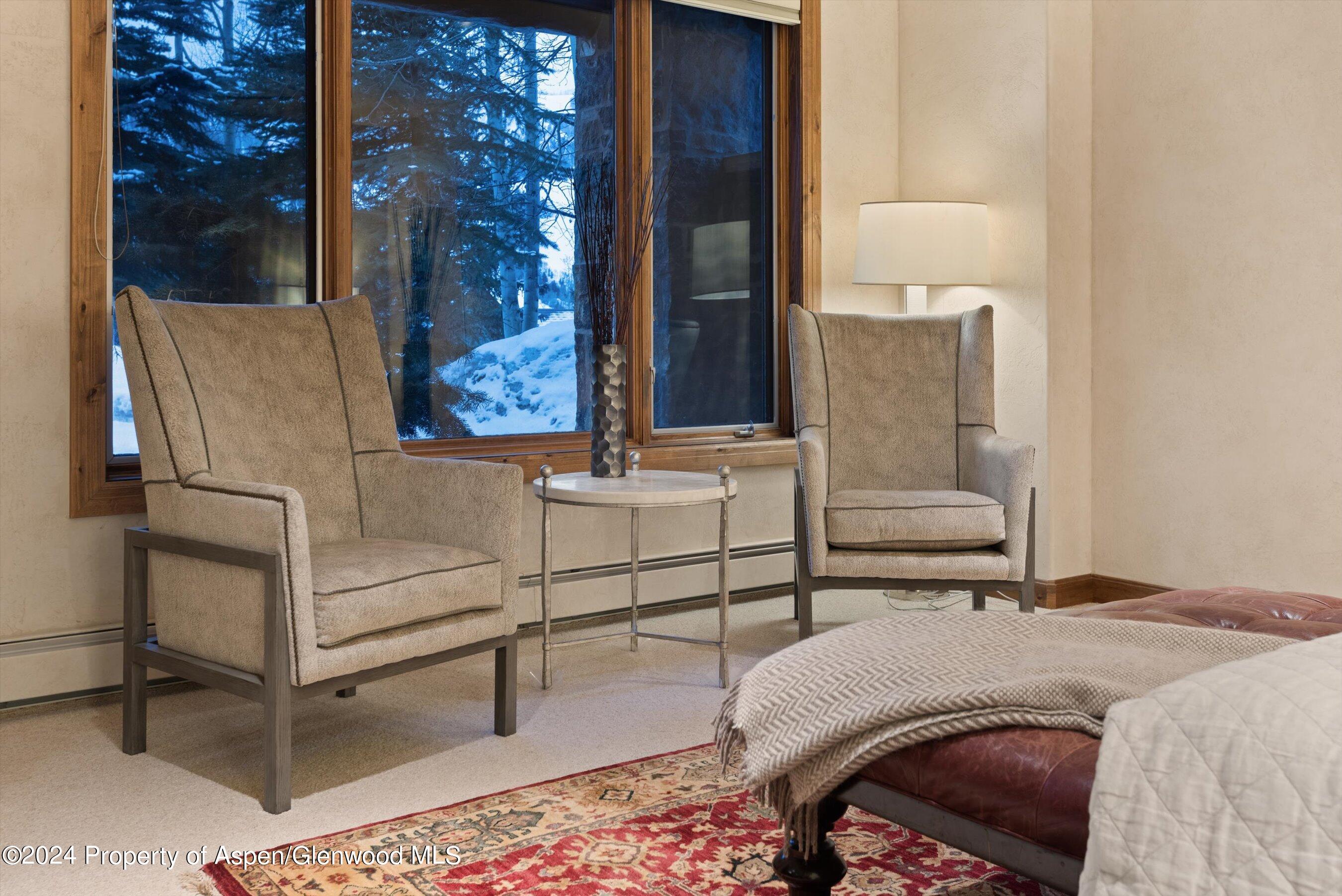 395 Silverlode Drive Aspen, CO 81611 - Photo 11 of 19 a bedroom with a bed and lamp