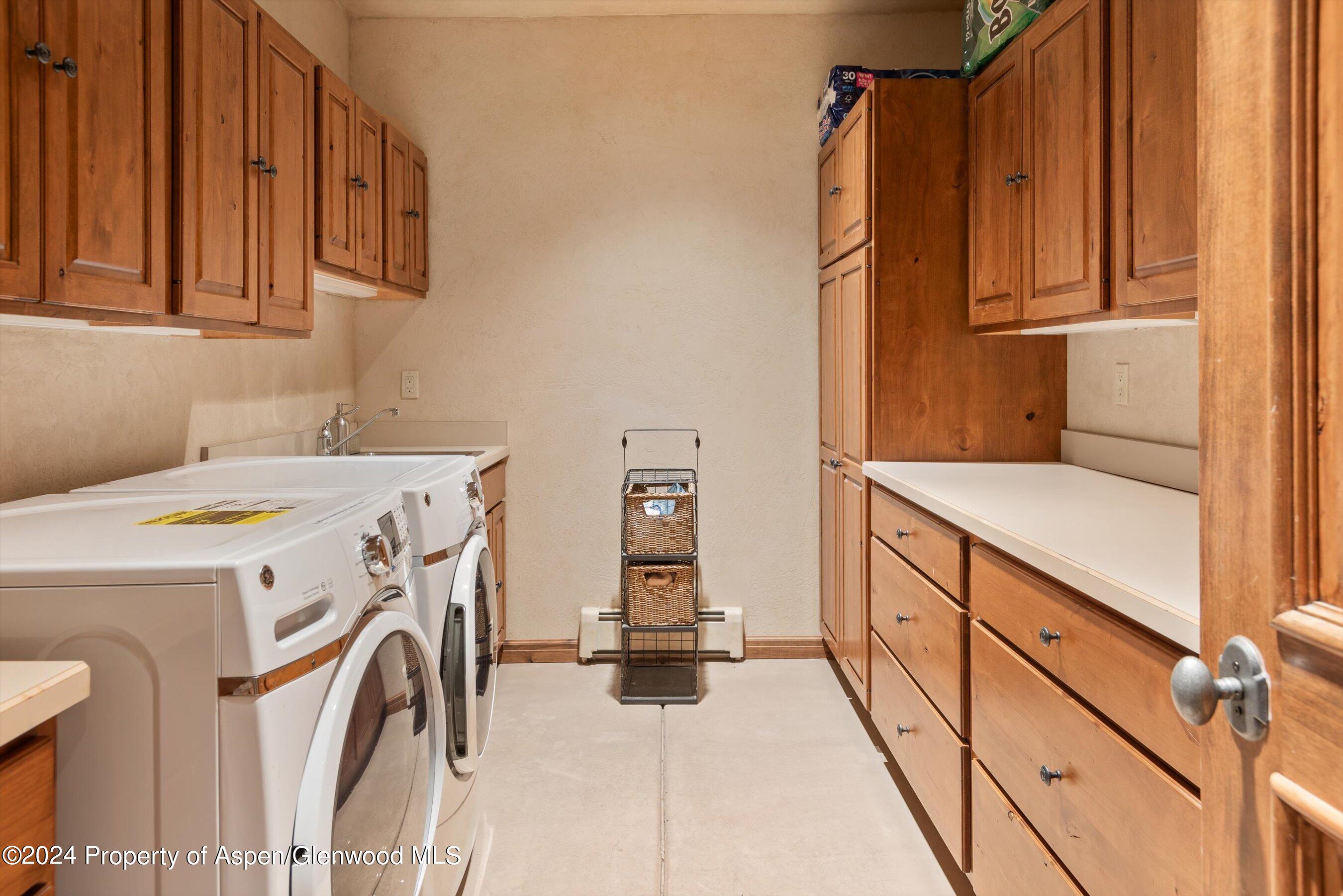 395 Silverlode Drive Aspen, CO 81611 - Photo 19 of 19 a view of storage and utility room with washer and dryer
