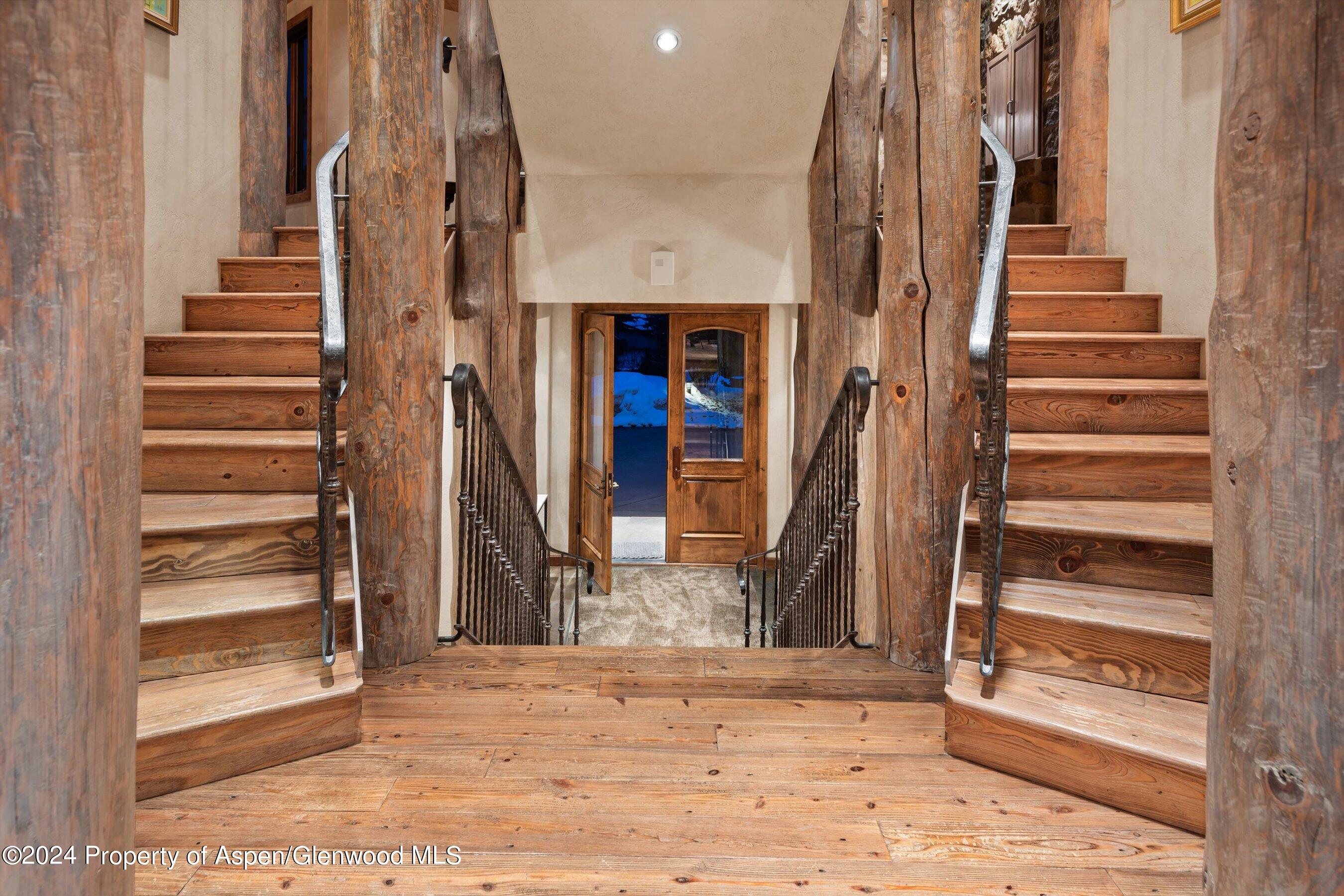 395 Silverlode Drive Aspen, CO 81611 - Photo 3 of 19 a view of entryway with wooden floor and windows