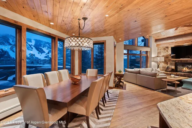 a view of a dining room with furniture window and outside view
