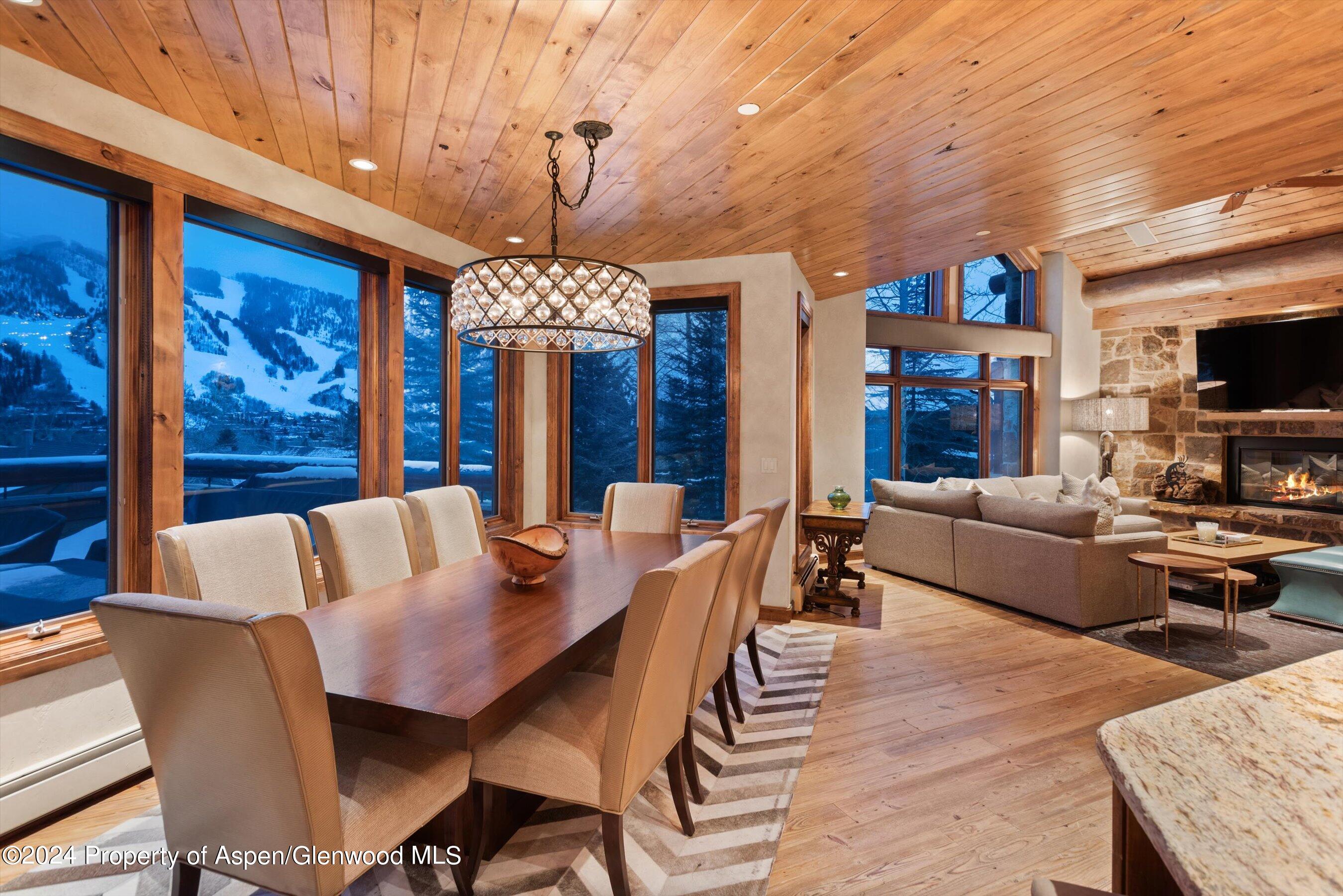 395 Silverlode Drive Aspen, CO 81611 - Photo 5 of 19 a view of a dining room with furniture window and wooden floor