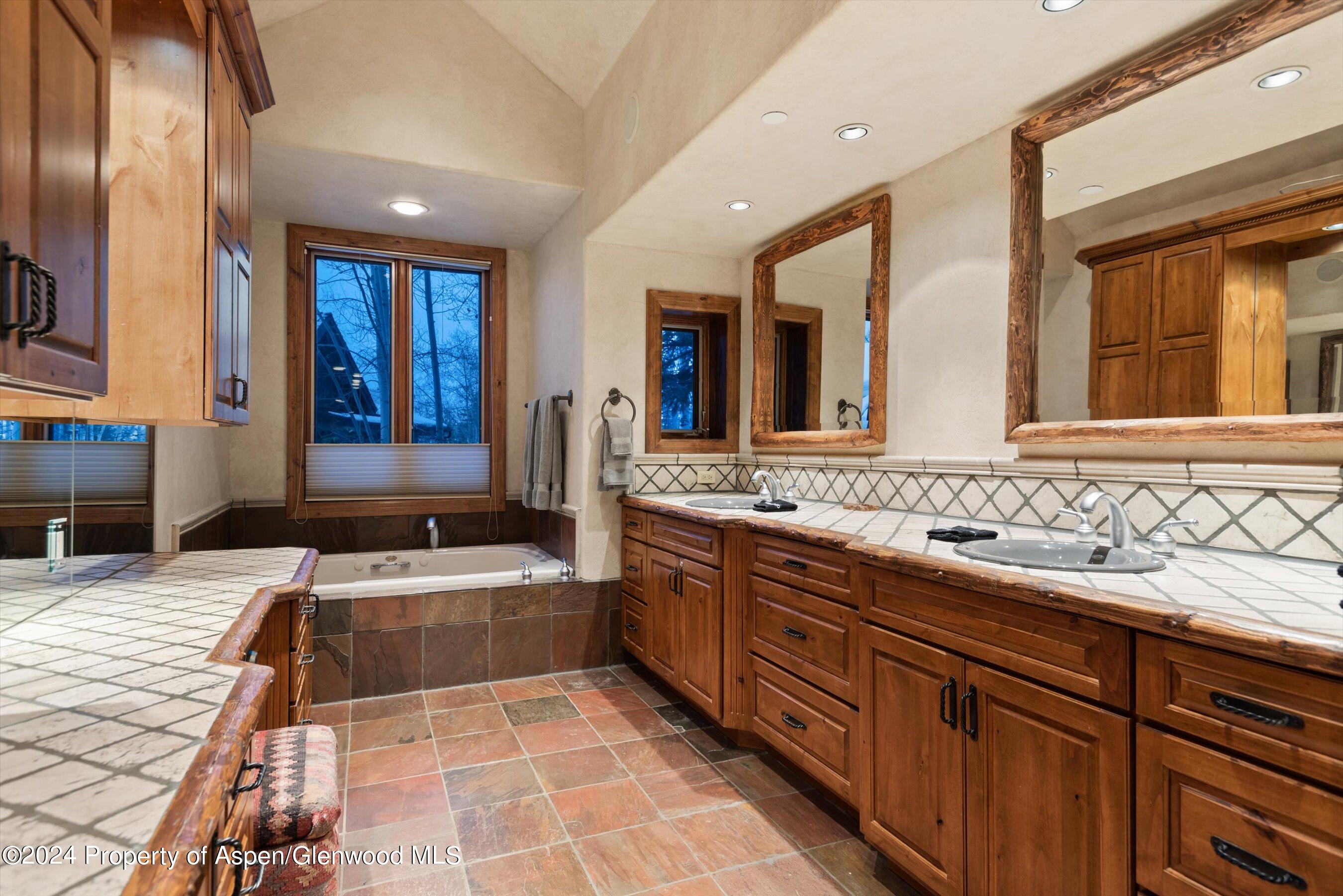 395 Silverlode Drive Aspen, CO 81611 - Photo 9 of 19 a bathroom with a sink and a mirror