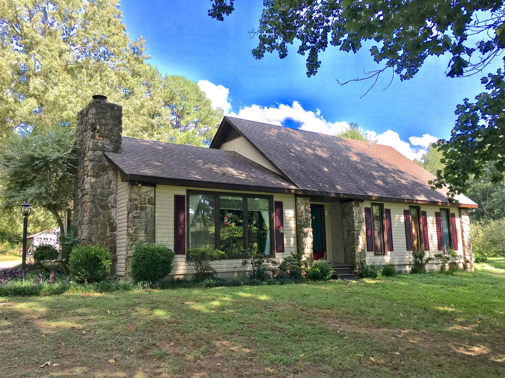 a view of a house with a garden