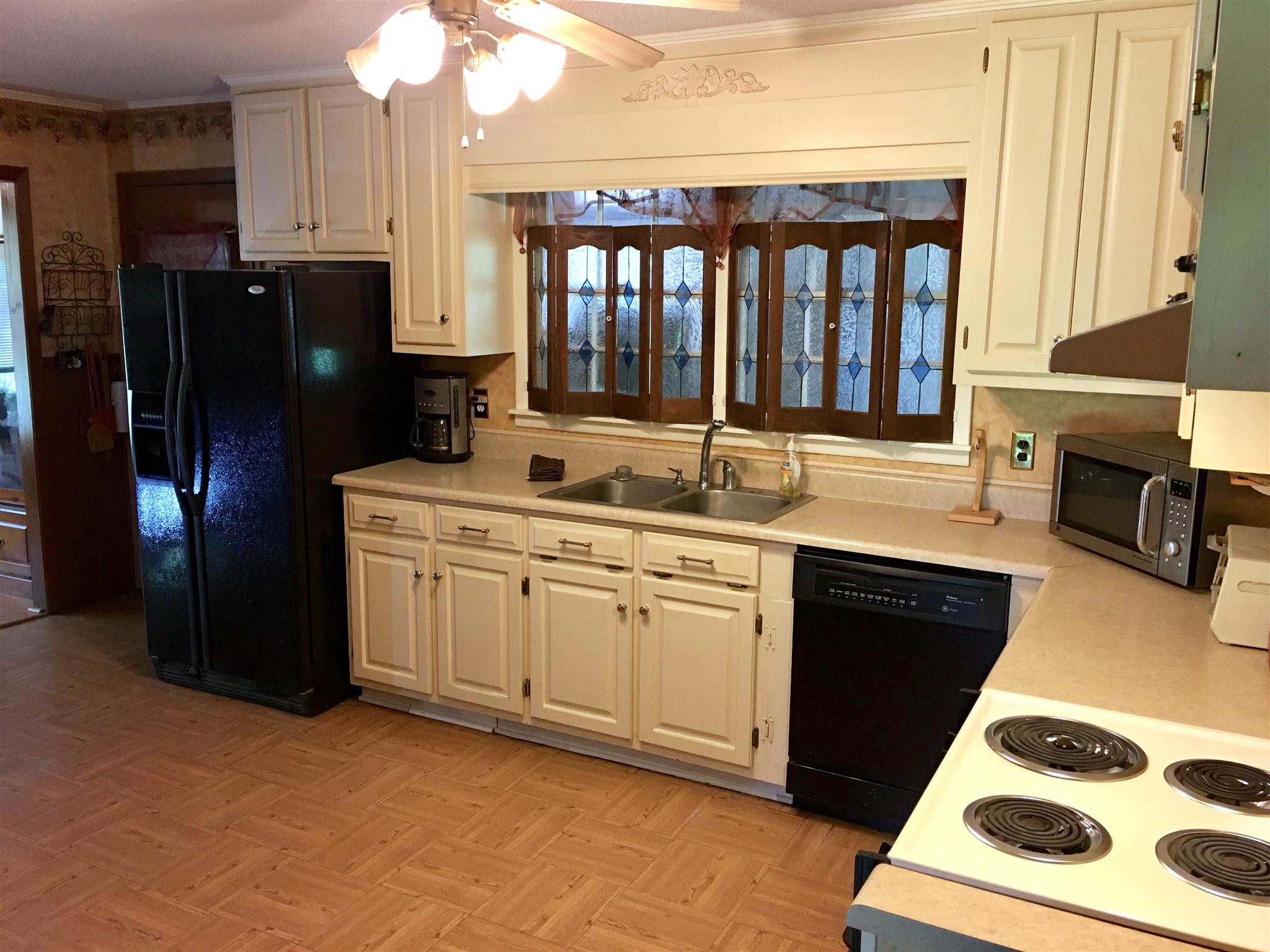 209 Bonnertown Road Five Points, TN 38457 - Photo 17 of 30 a kitchen with a sink stove and refrigerator