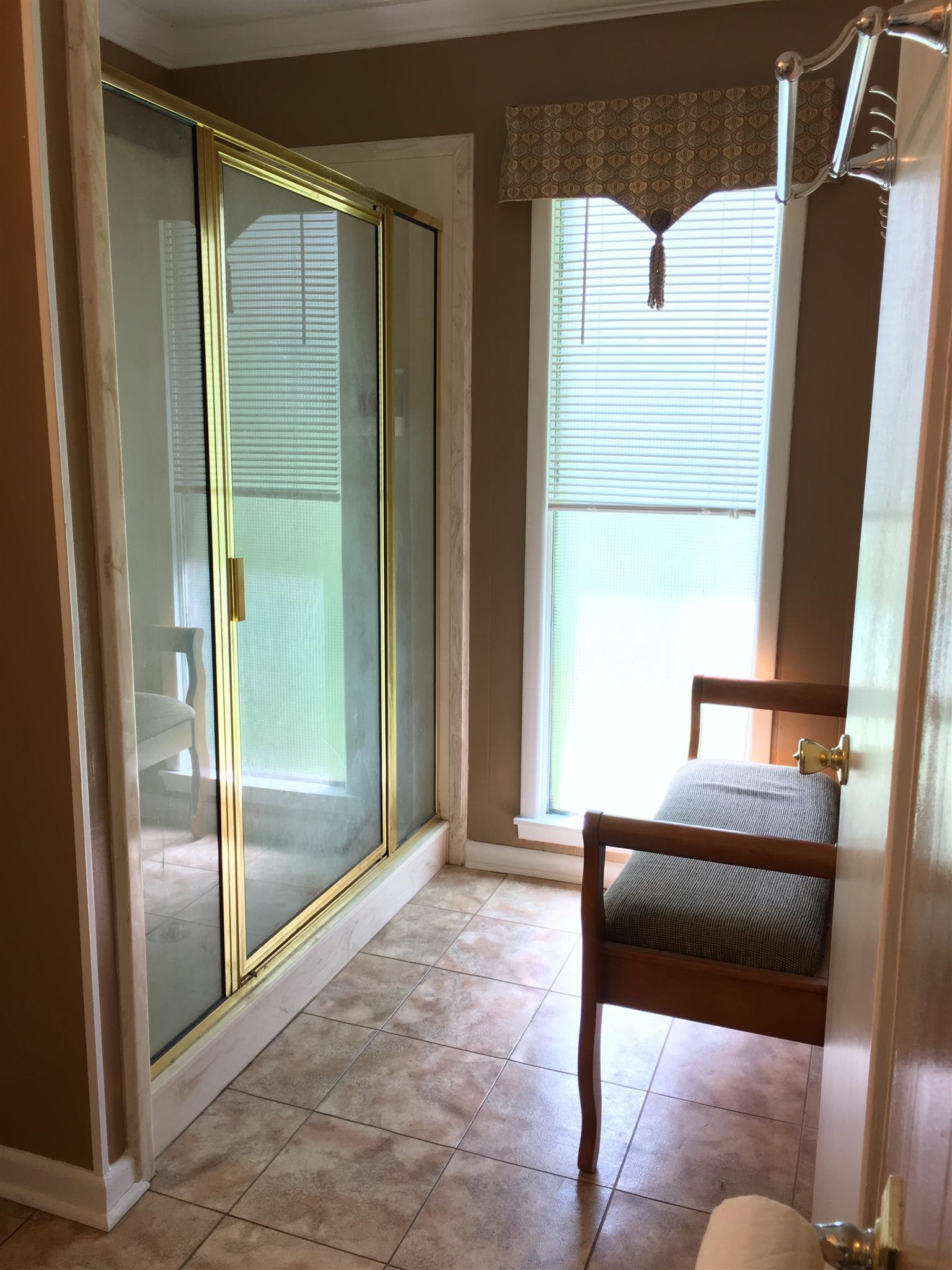 209 Bonnertown Road Five Points, TN 38457 - Photo 22 of 30 a living room with a couch and a glass door shower