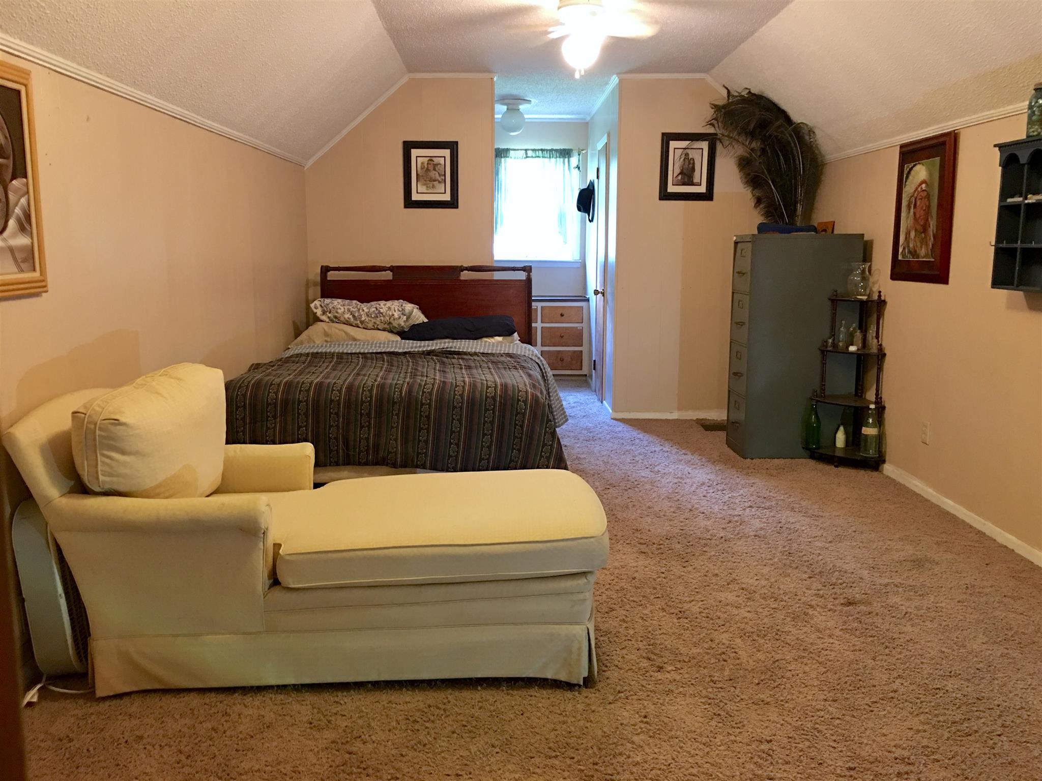 209 Bonnertown Road Five Points, TN 38457 - Photo 24 of 30 a bedroom with a bed and wooden floor