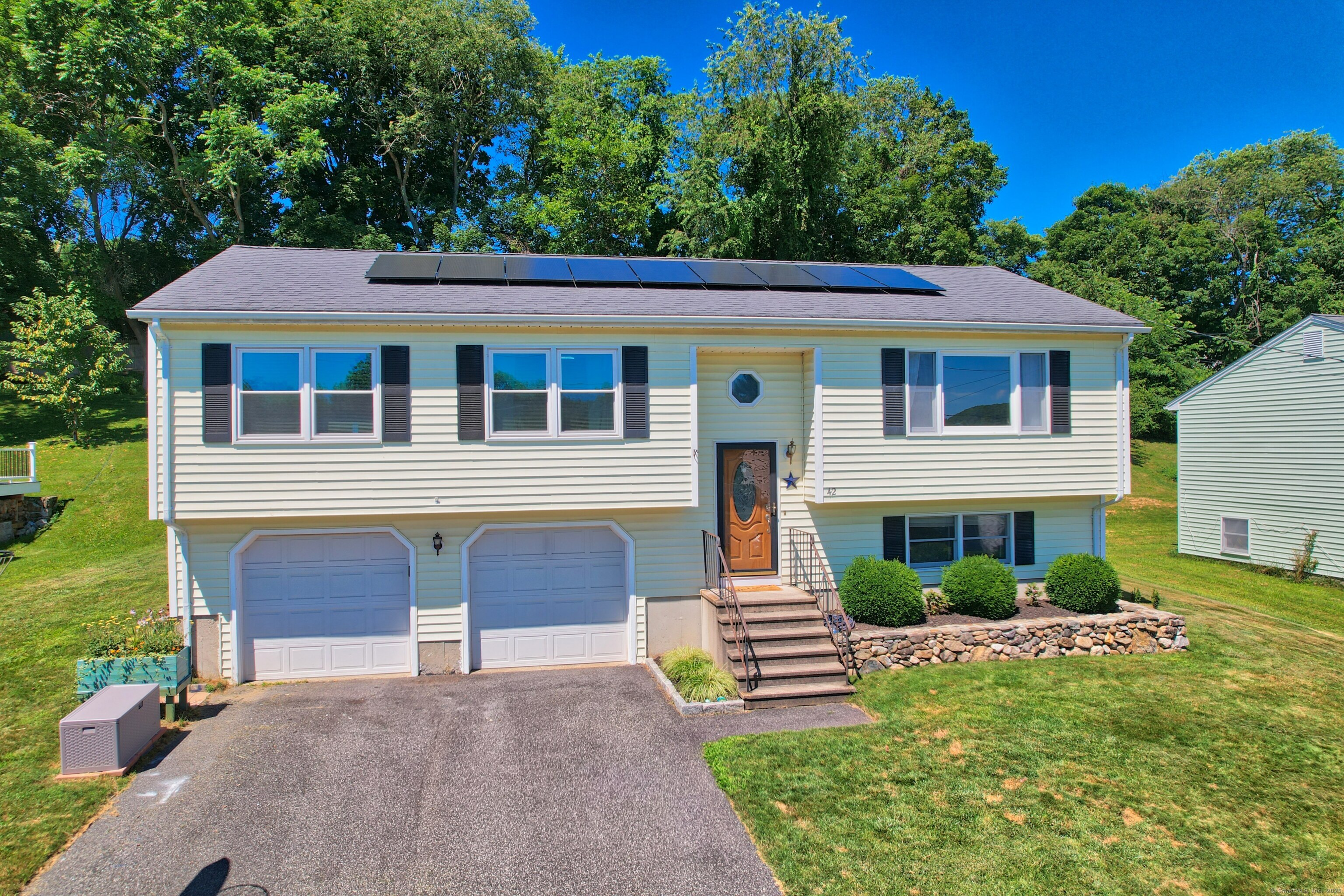 42 Laurel Ridge Drive Watertown, CT 06779 - Photo 1 of 1 a front view of a house with a yard