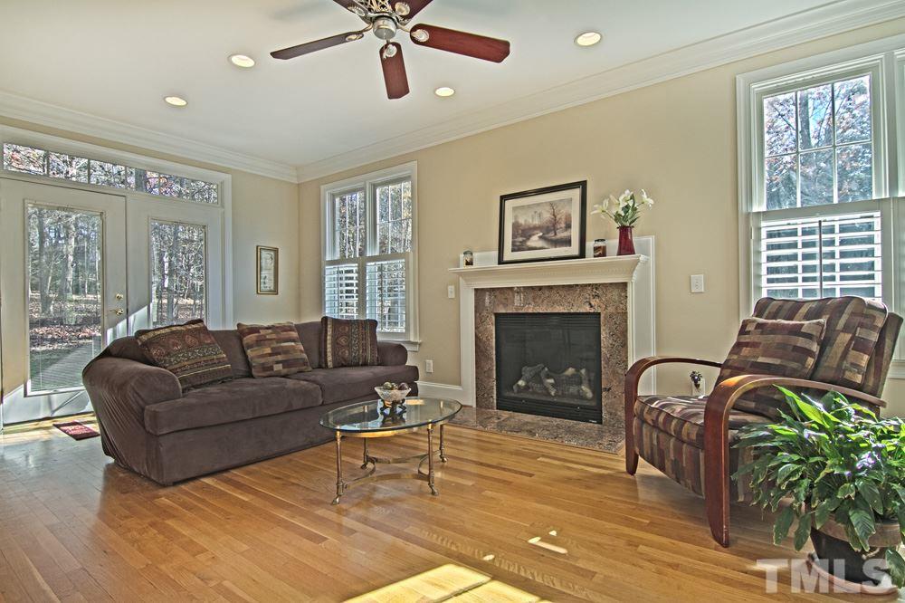 120 Bayleaf Drive Raleigh, NC 27615 - Photo 11 of 25 a living room with furniture and a fireplace