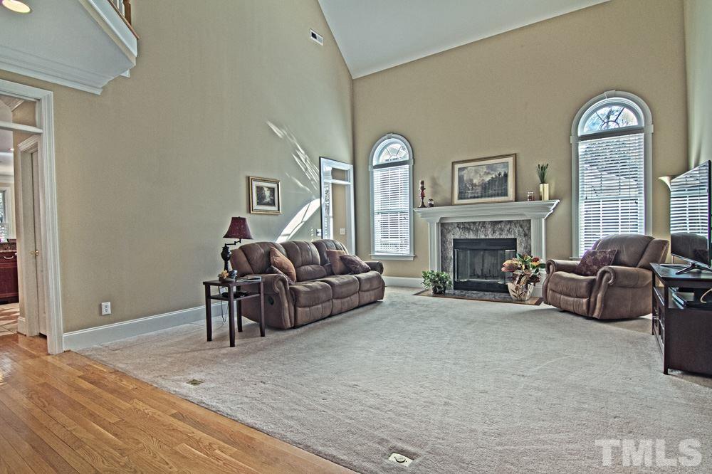 120 Bayleaf Drive Raleigh, NC 27615 - Photo 12 of 25 a living room with furniture and a fireplace