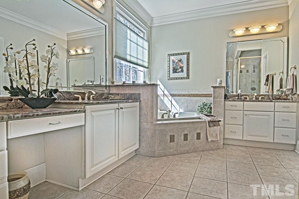 120 Bayleaf Drive Raleigh, NC 27615 - Photo 17 of 25 a bathroom with a sink and a mirror