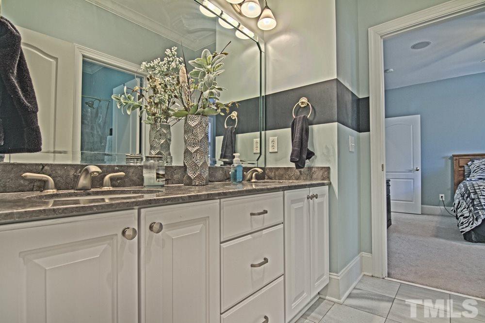 120 Bayleaf Drive Raleigh, NC 27615 - Photo 19 of 25 a bathroom with a double vanity sink and a mirror