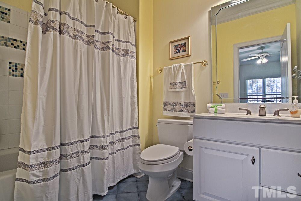 120 Bayleaf Drive Raleigh, NC 27615 - Photo 21 of 25 a bathroom with a toilet a sink and a shower