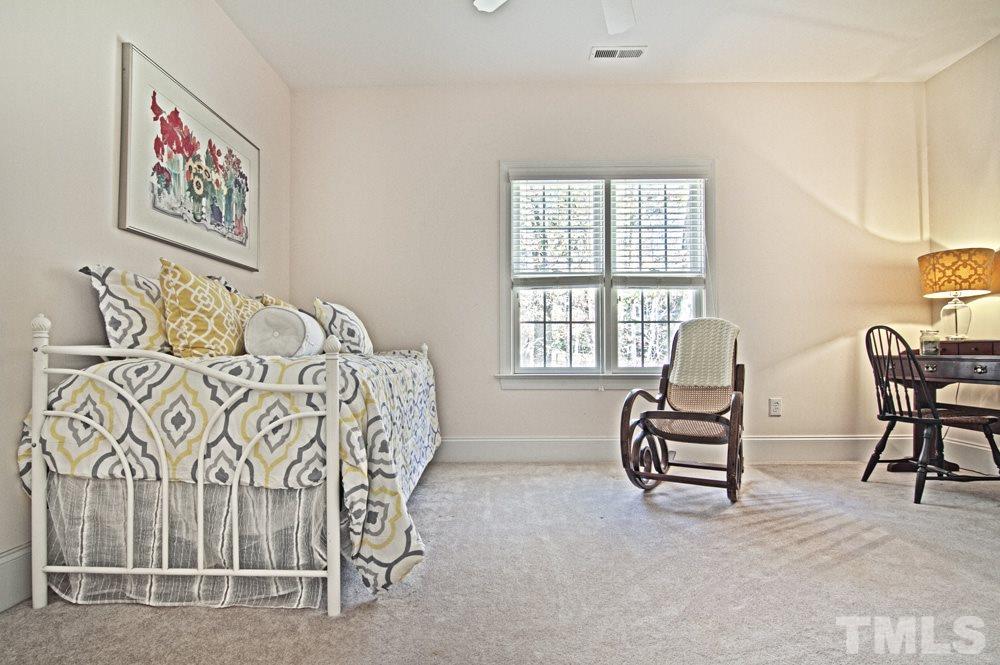120 Bayleaf Drive Raleigh, NC 27615 - Photo 23 of 25 a bedroom with furniture and a window
