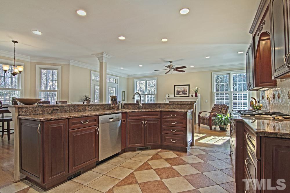 120 Bayleaf Drive Raleigh, NC 27615 - Photo 8 of 25 a kitchen with stainless steel appliances granite countertop a sink and cabinets