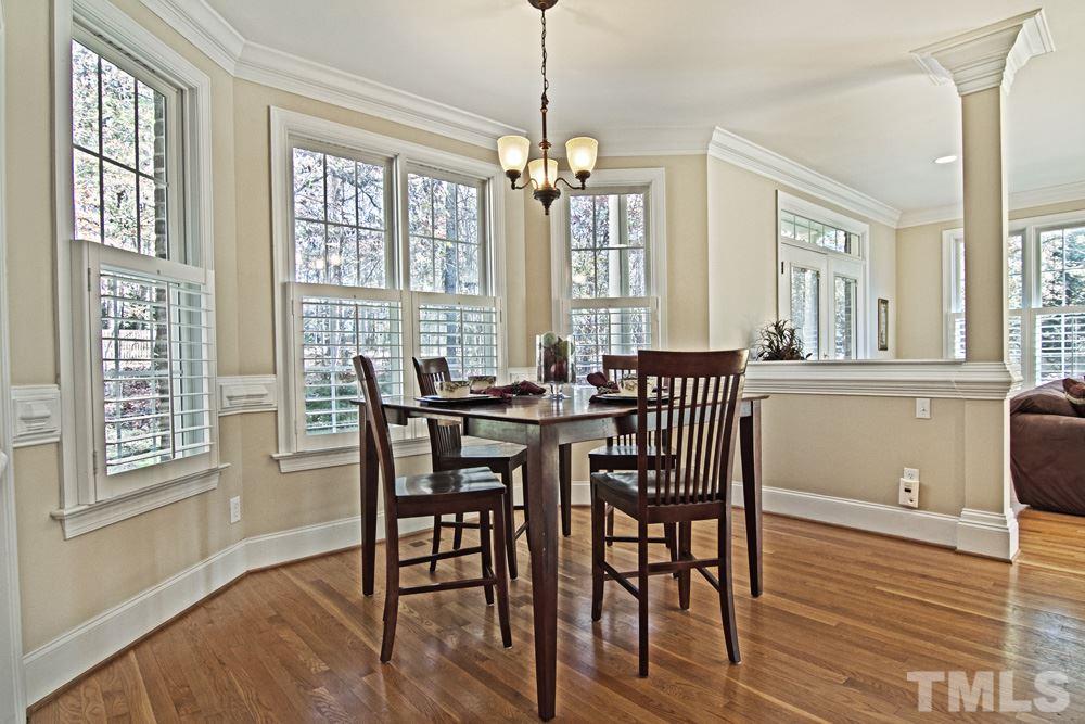 120 Bayleaf Drive Raleigh, NC 27615 - Photo 10 of 25 a view of a a dining room with furniture window and wooden floor