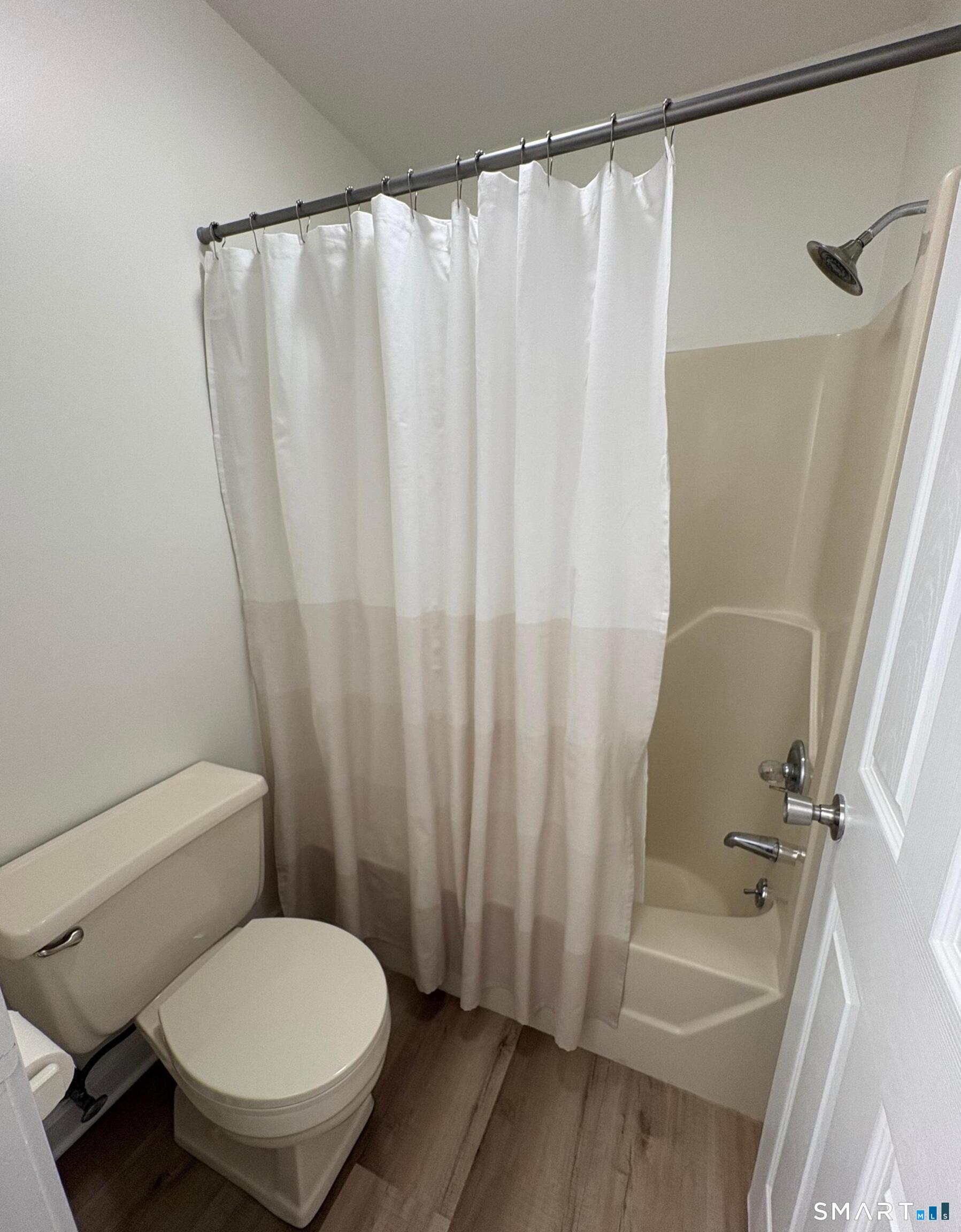 295 Redstone Hill Road, Unit 24 Bristol, CT 06010 - Photo 12 of 17 a bathroom with a sink and a toilet