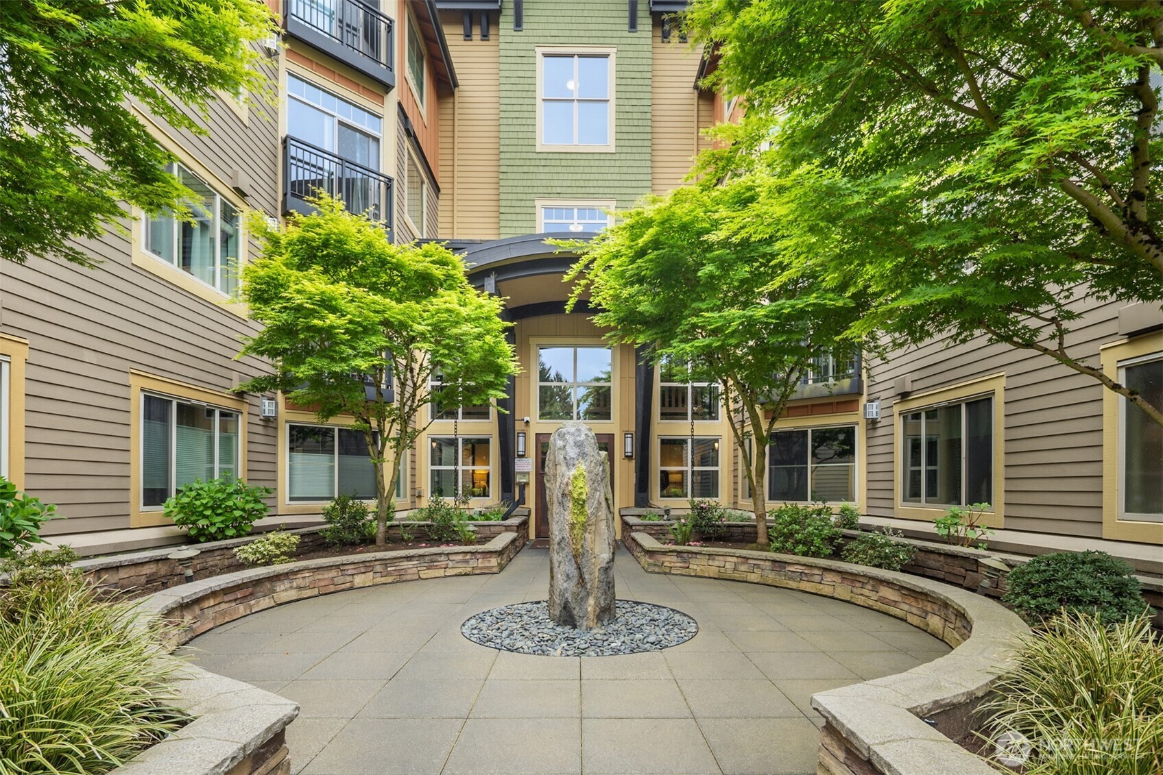 15700 116th Avenue Northeast, Unit 404 Bothell, WA 98011 - Photo 2 of 31 a front view of a house with porch