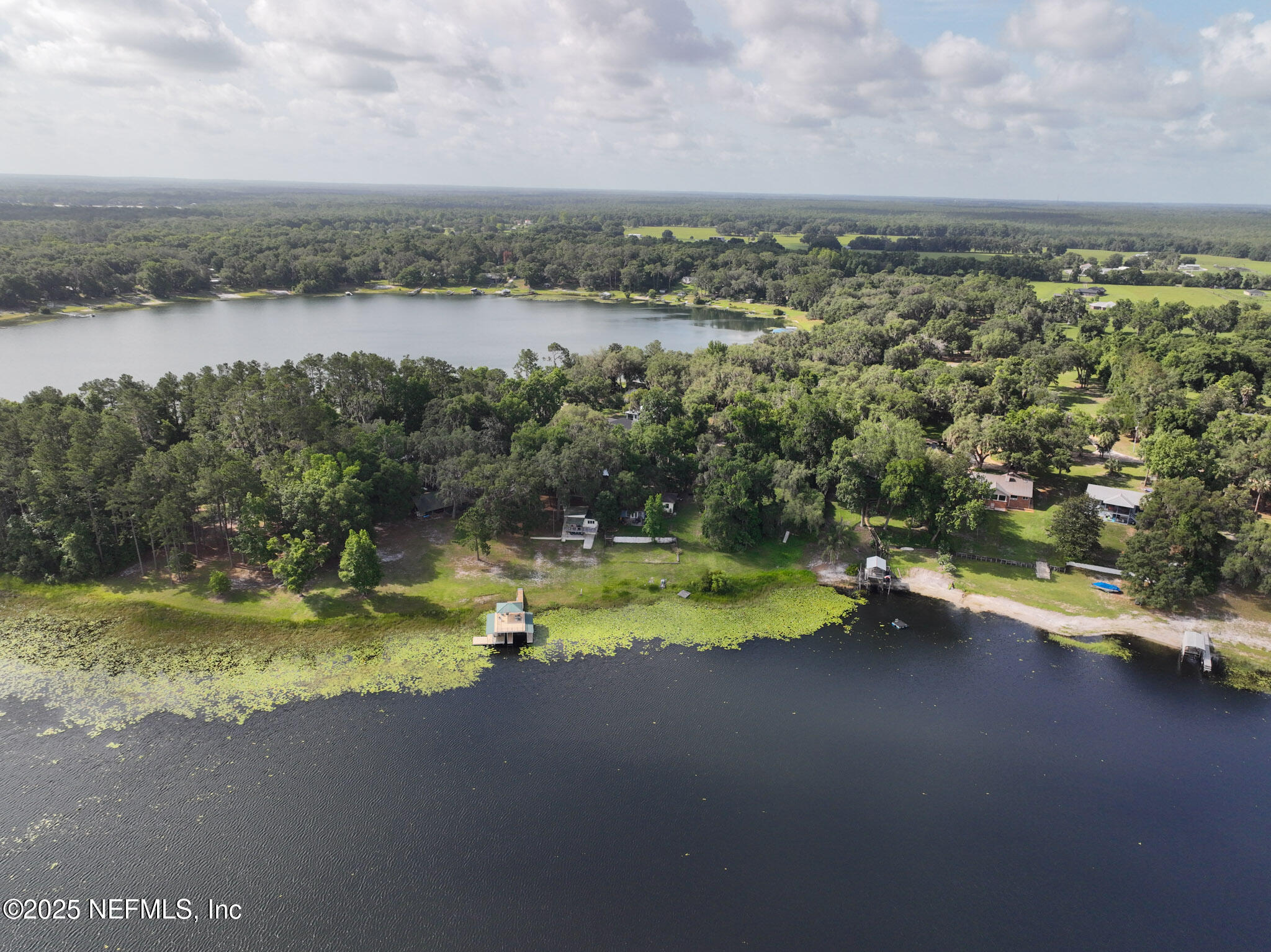 8160 Alderman Road Melrose, FL 32666 - Photo 3 of 15 a view of a lake with a city