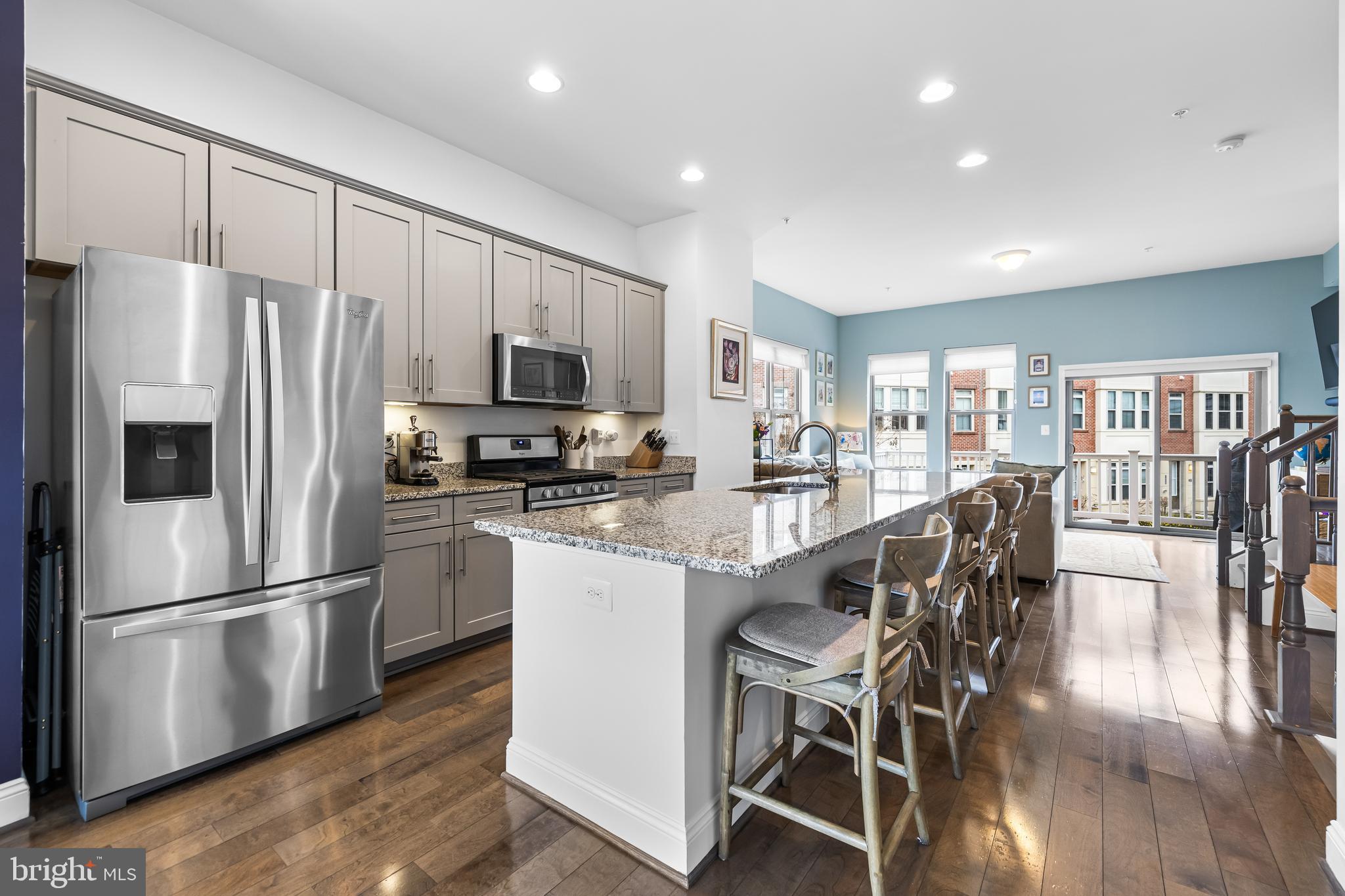 1201 Andre Street Baltimore, MD 21230 - Photo 14 of 39 a kitchen with stainless steel appliances granite countertop a refrigerator a stove microwave and a dining table