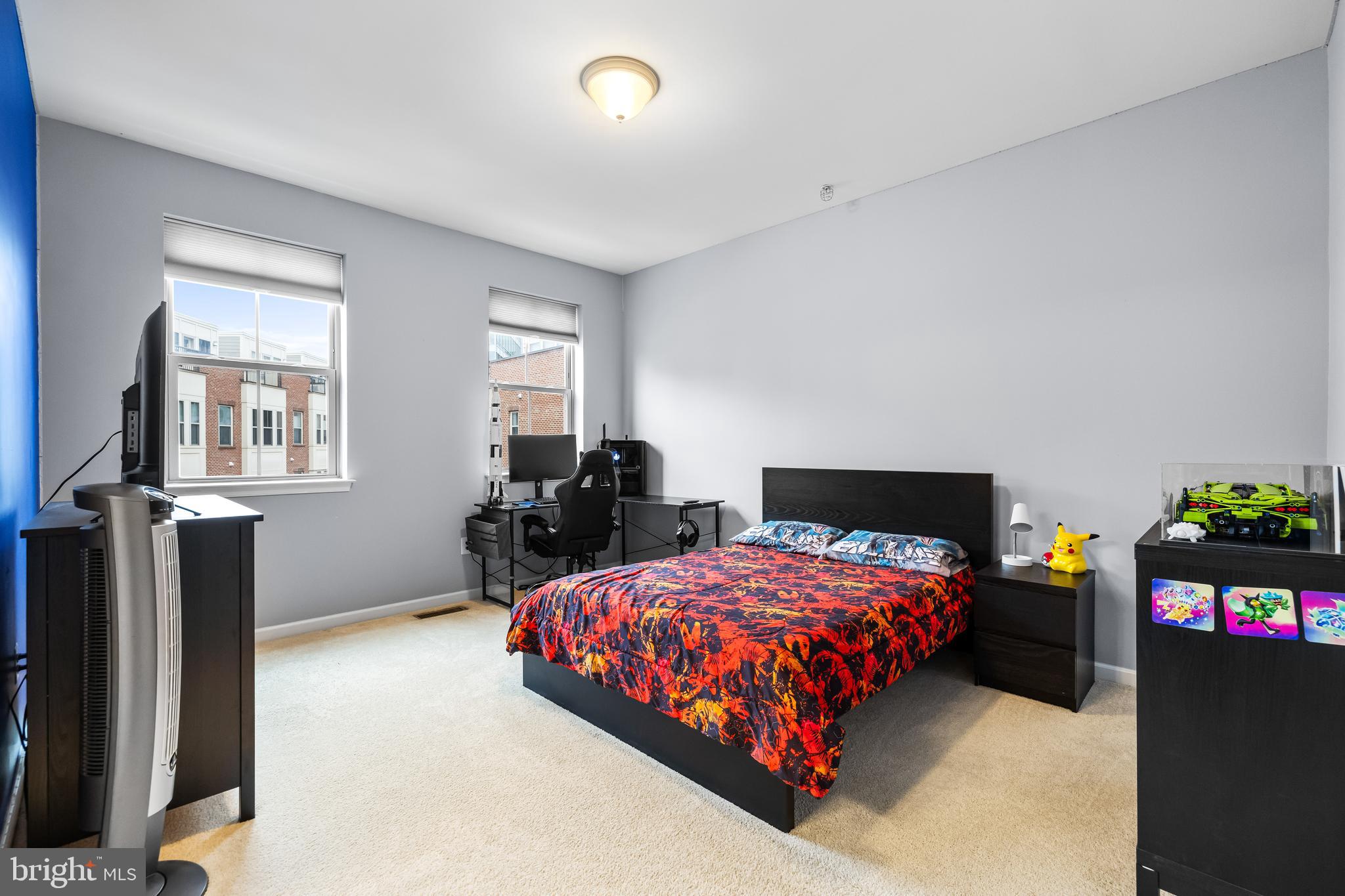 1201 Andre Street Baltimore, MD 21230 - Photo 25 of 39 a bedroom with a bed dresser and a window