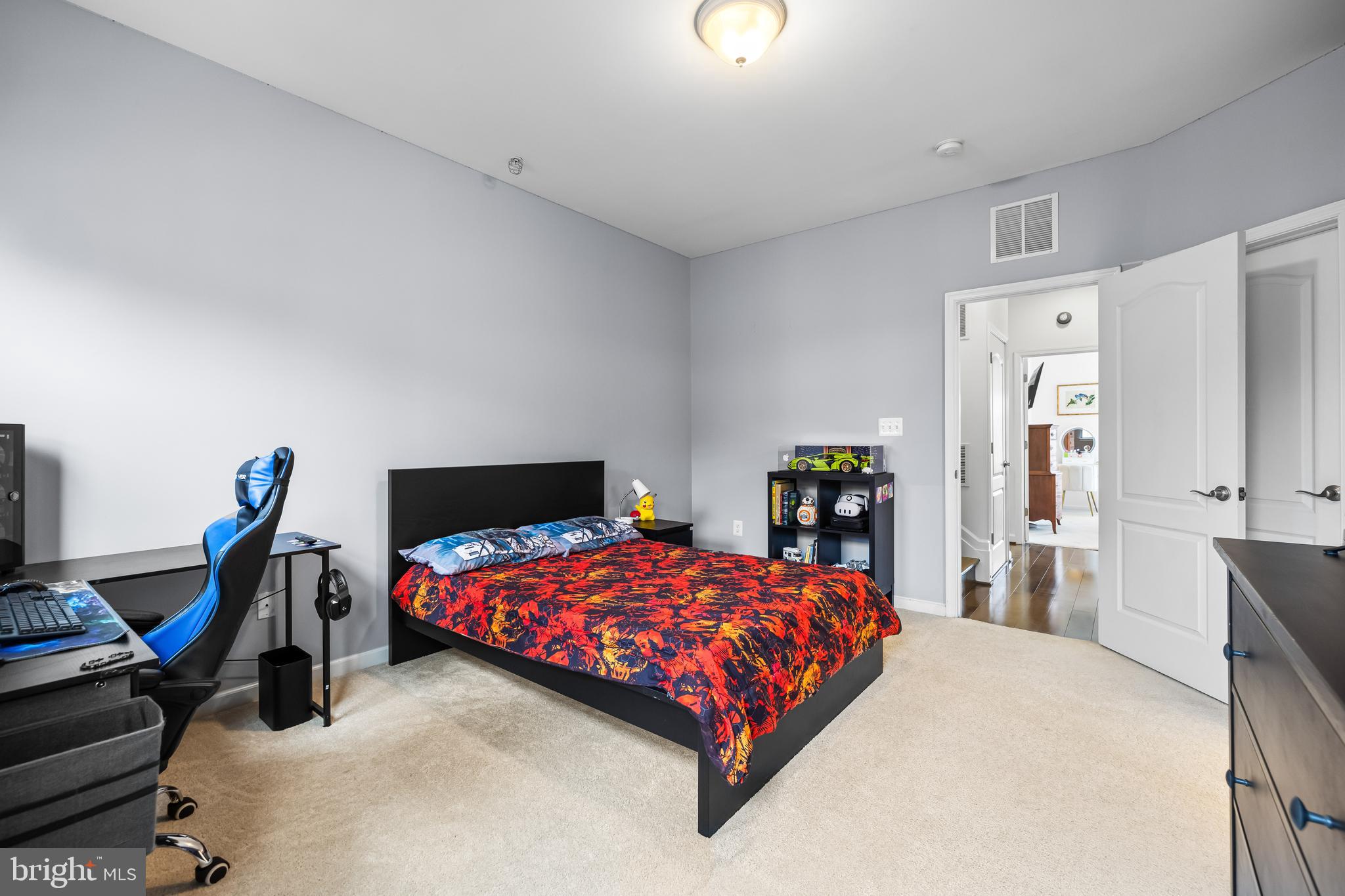 1201 Andre Street Baltimore, MD 21230 - Photo 26 of 39 a bedroom with a bed a desk and chair