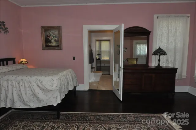 a bedroom with bed and walk in closet