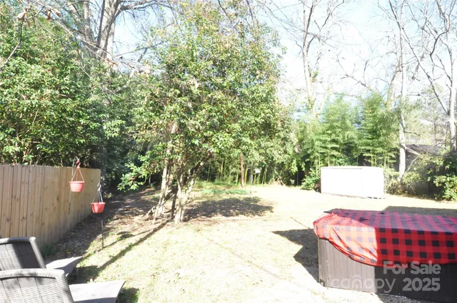 a view of outdoor space with deck and tree