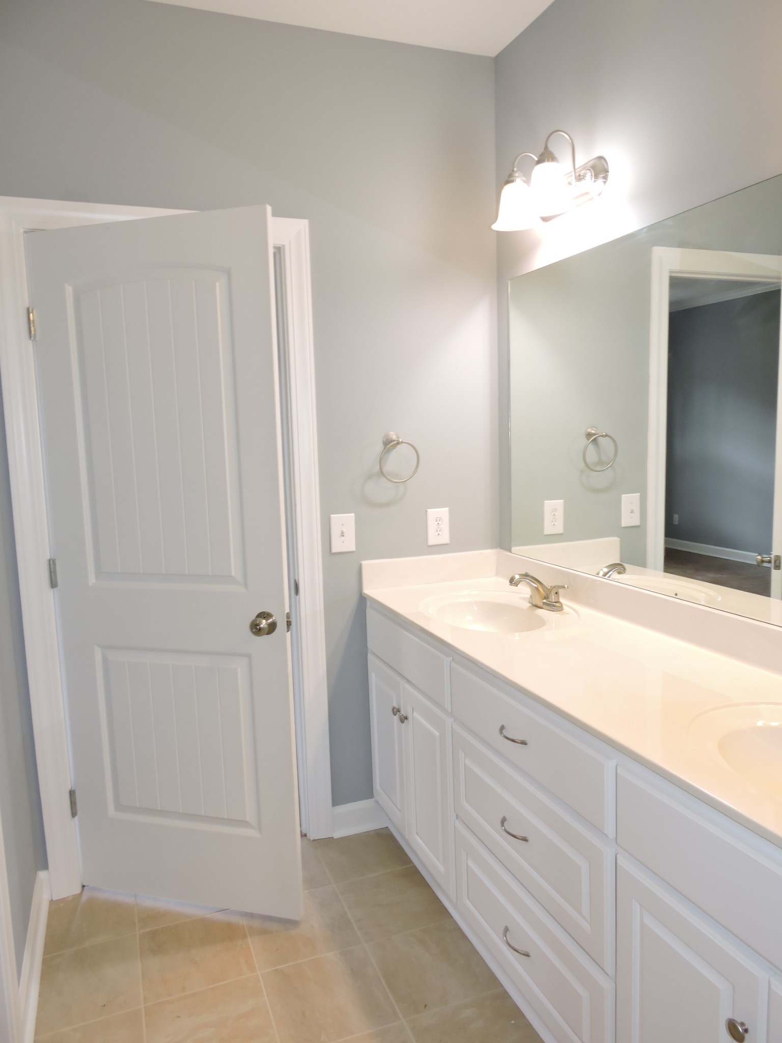 187 Oak Hollow Road Manchester, TN 37355 - Photo 11 of 25 a bathroom with a double vanity sink and a mirror