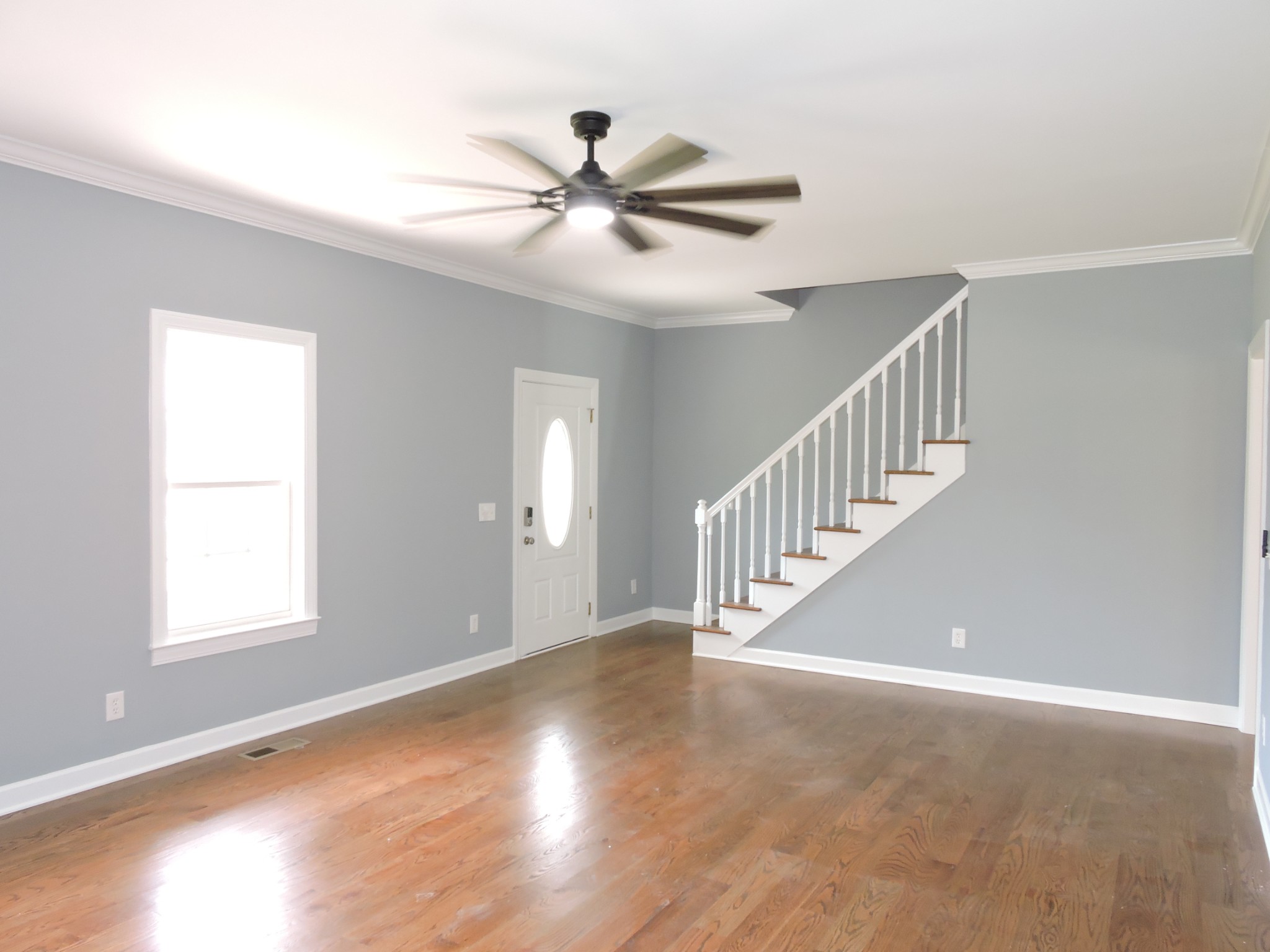 187 Oak Hollow Road Manchester, TN 37355 - Photo 3 of 25 a view of an empty room with wooden floor and a window