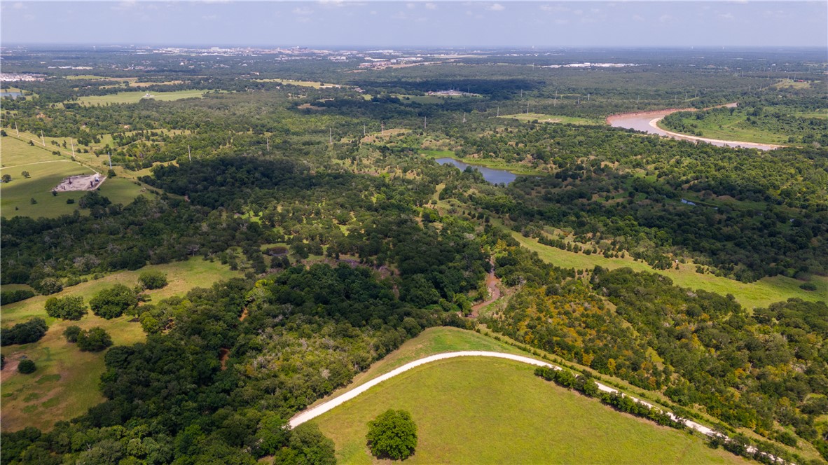 0 Leonard Road Bryan, TX 77807 - Photo 6 of 24 Drone / aerial view of a large body of water and a heavily wooded area