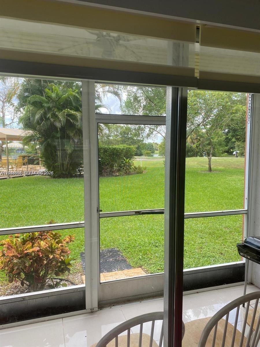 8838 West McNab Road, Unit 104 Tamarac, FL 33321 - Photo 17 of 23 a view of a garden from a window