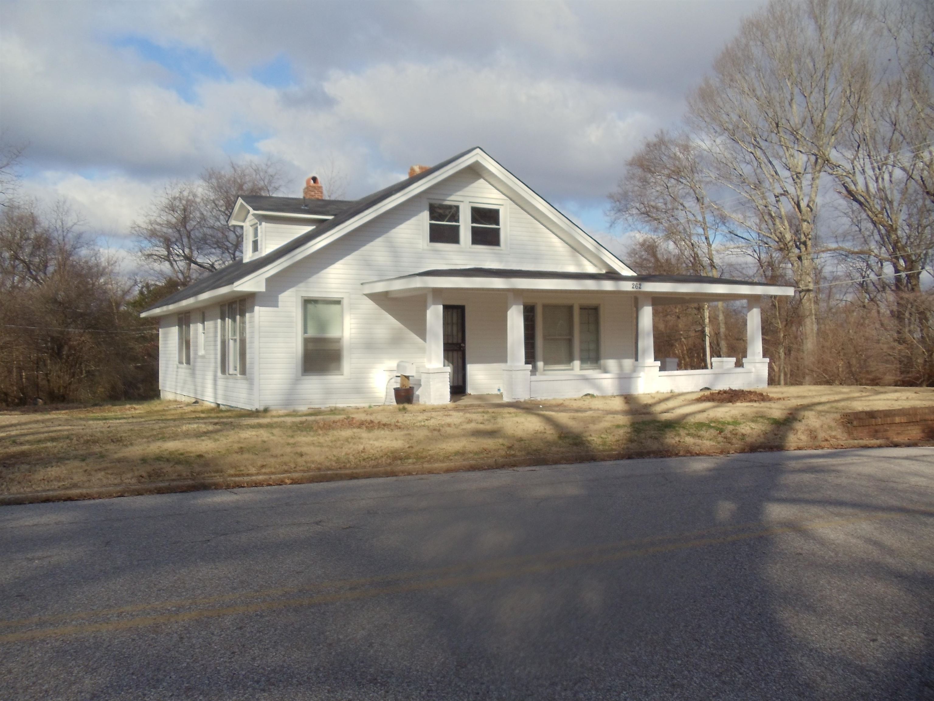 262 Lake Drive Ripley, TN 38063 - Photo 1 of 25 a front view of a house with a yard