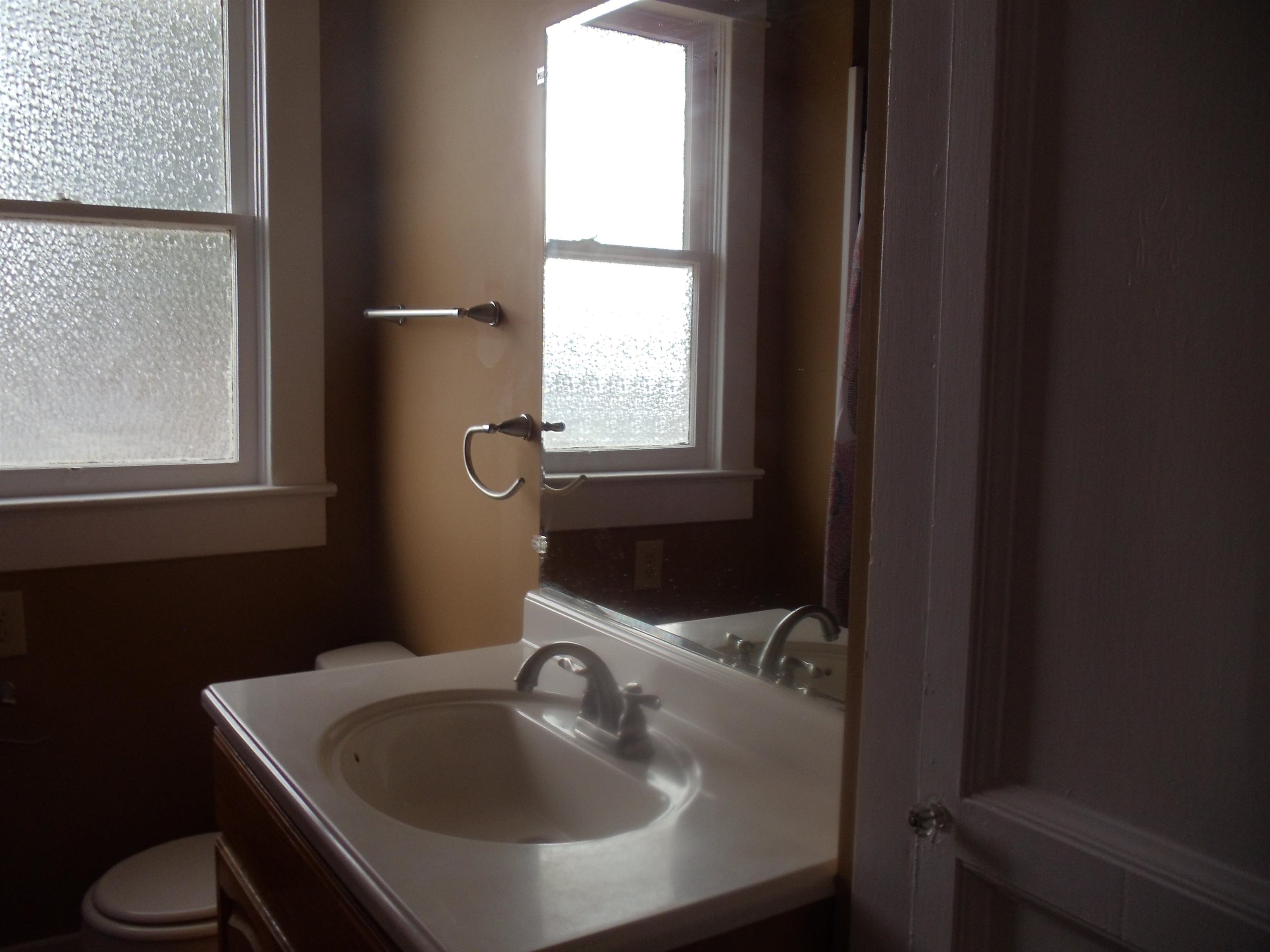 262 Lake Drive Ripley, TN 38063 - Photo 13 of 25 a bathroom with a sink toilet and mirror