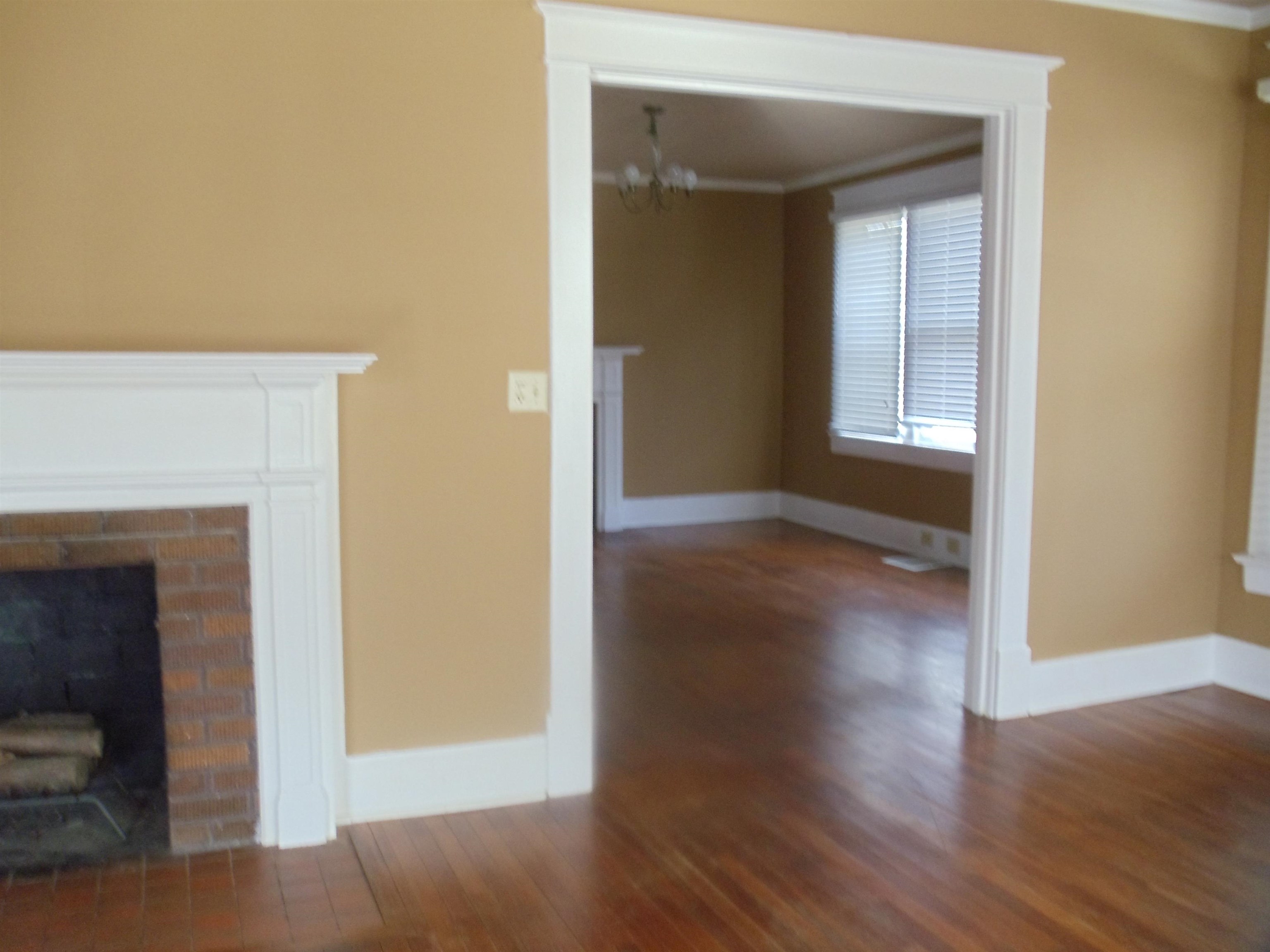 262 Lake Drive Ripley, TN 38063 - Photo 3 of 25 a view of a livingroom with wooden floor and a fireplace