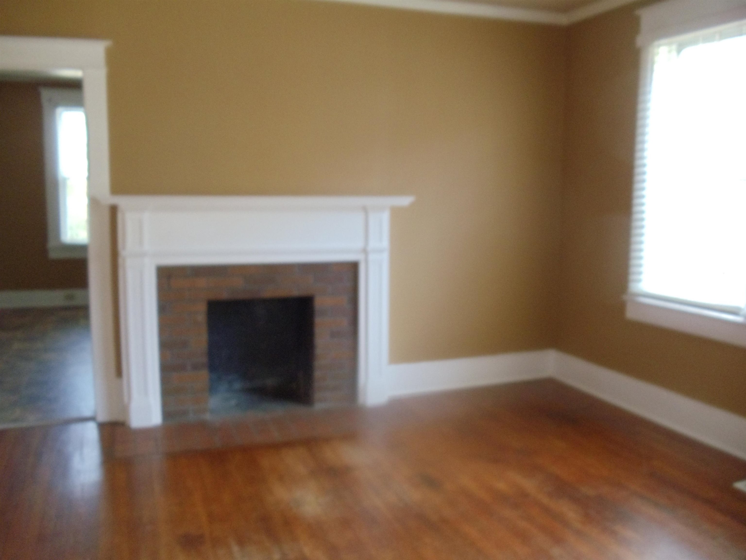 262 Lake Drive Ripley, TN 38063 - Photo 6 of 25 a view of an empty room with wooden floor and a window