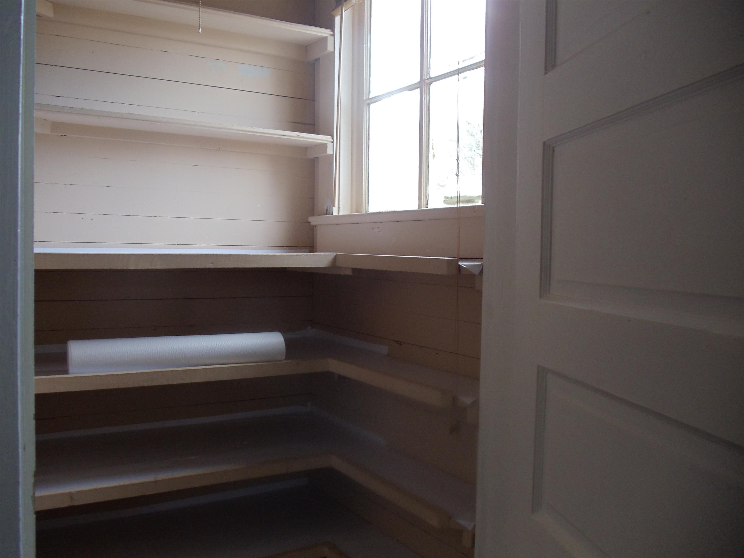 262 Lake Drive Ripley, TN 38063 - Photo 9 of 25 a view of storage and utility room with racks on the wall