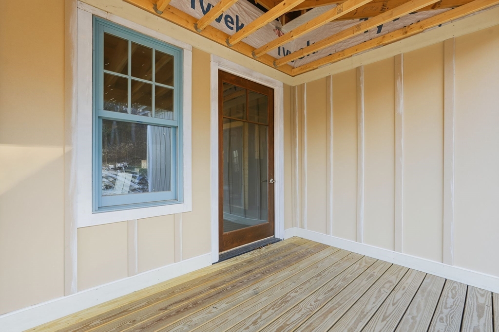 63 Cooleyville Road New Salem, MA 01355 - Photo 5 of 39 a view of an empty room with wooden floor and a window