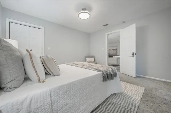 a bedroom with a bed and closet