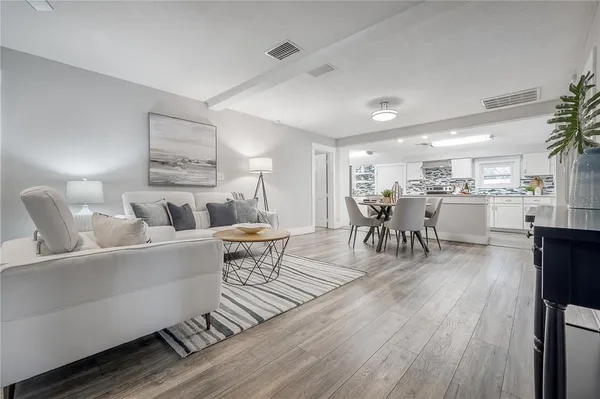 a living room with furniture and a table