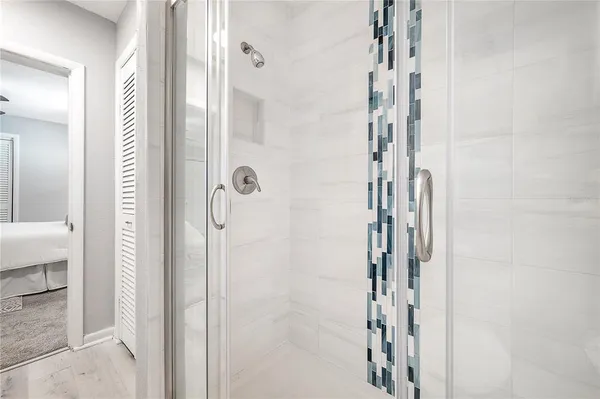 a bathroom with a shower and a toilet