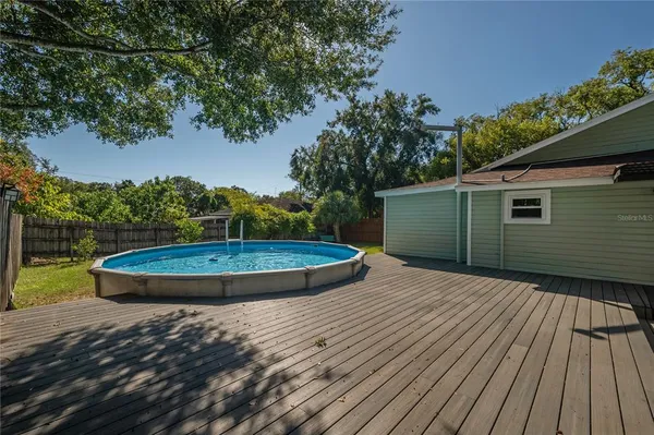 a view of a backyard with wooden floor
