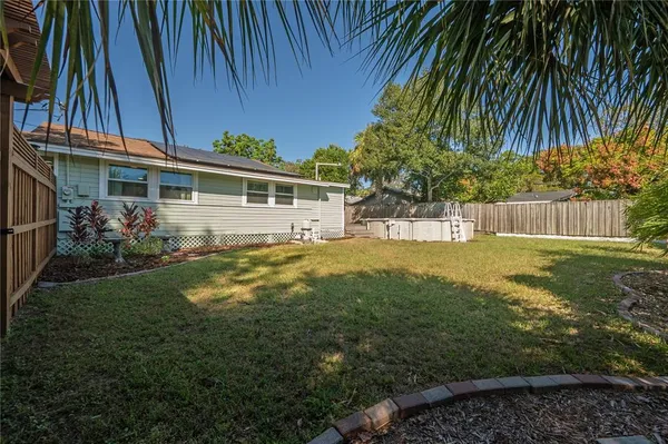 a view of house with yard