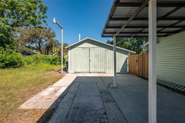 a view of backyard with green space
