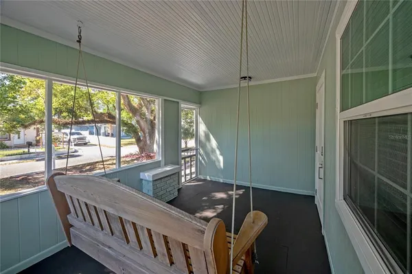 a view of a balcony with furniture