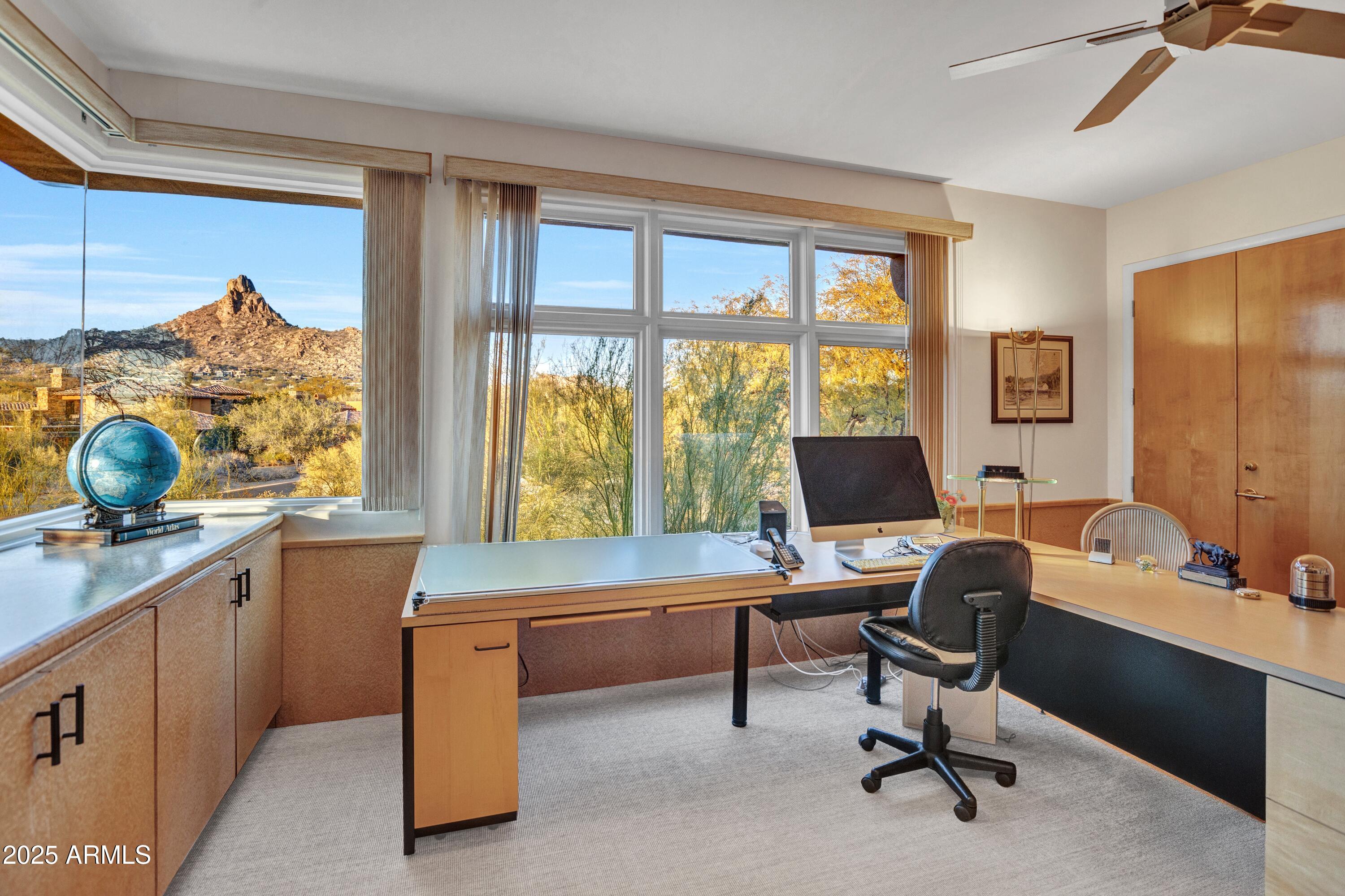10040 East Happy Valley Road, Unit 595 Scottsdale, AZ 85255 - Photo 1 of 48 a work room with furniture and a window