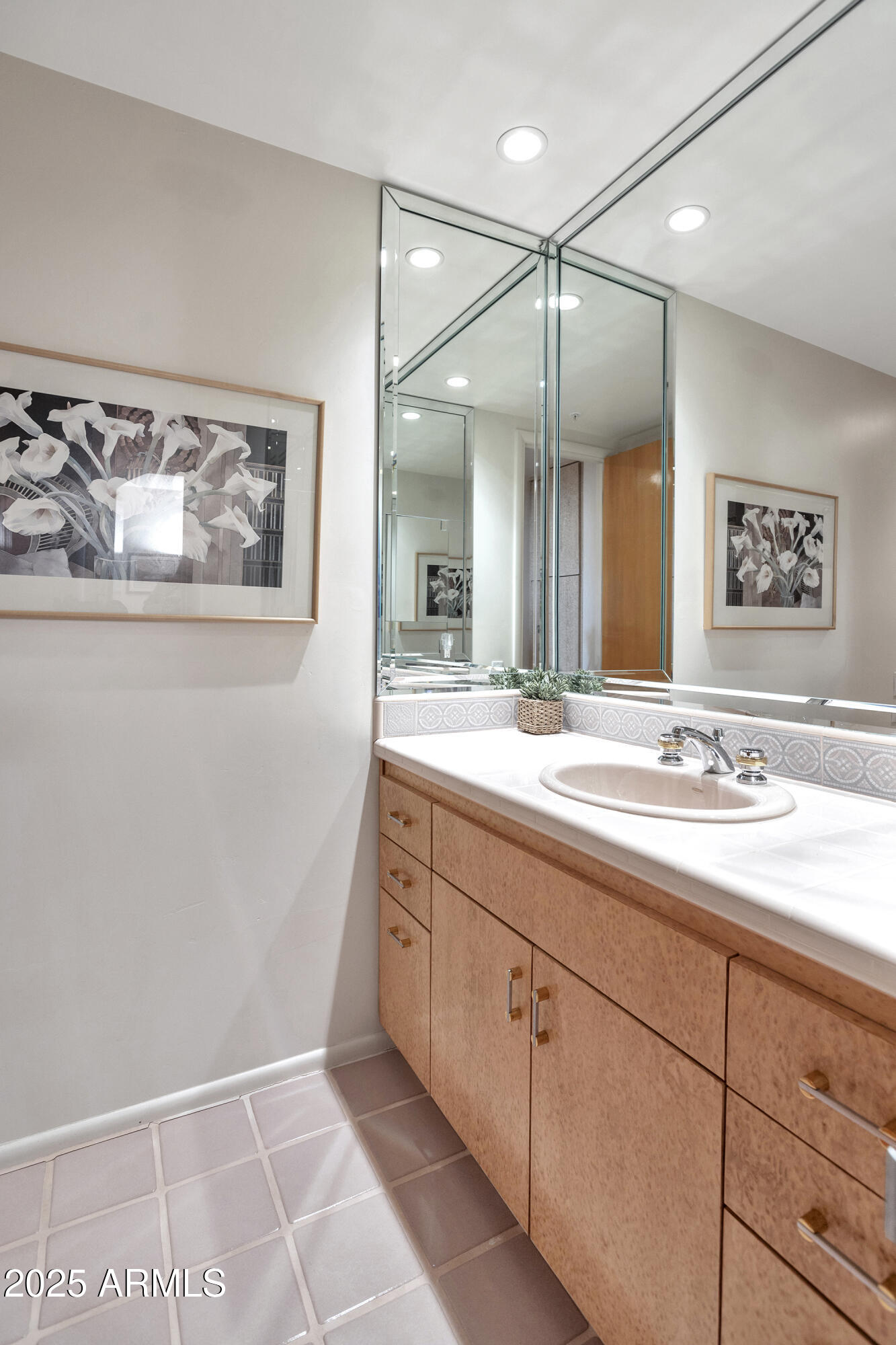 10040 East Happy Valley Road, Unit 595 Scottsdale, AZ 85255 - Photo 28 of 48 a bathroom with a sink a vanity and a large mirror