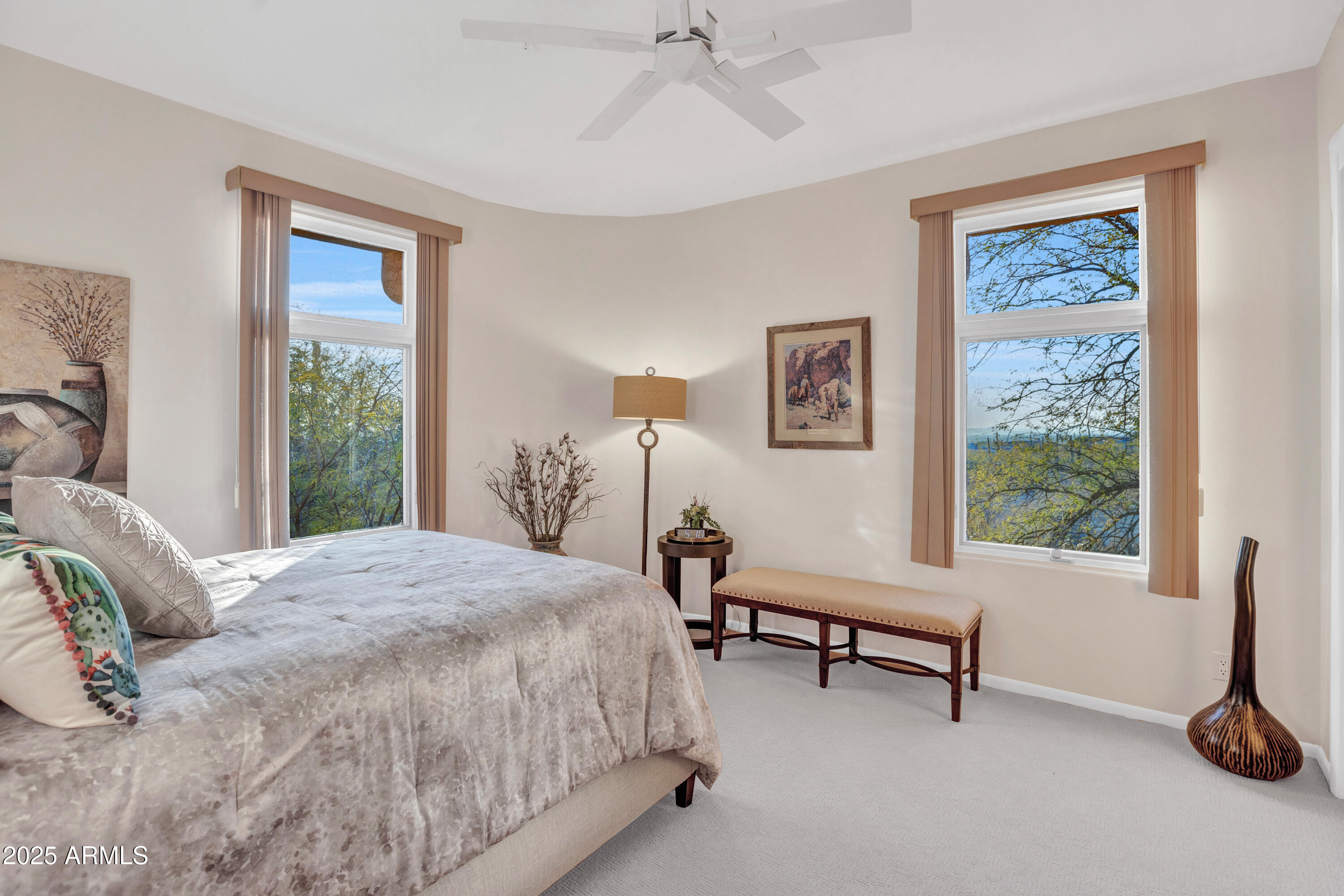 10040 East Happy Valley Road, Unit 595 Scottsdale, AZ 85255 - Photo 29 of 48 a bedroom with a bed and a window